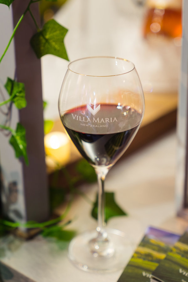 A Villa Maria branded glass of red wine